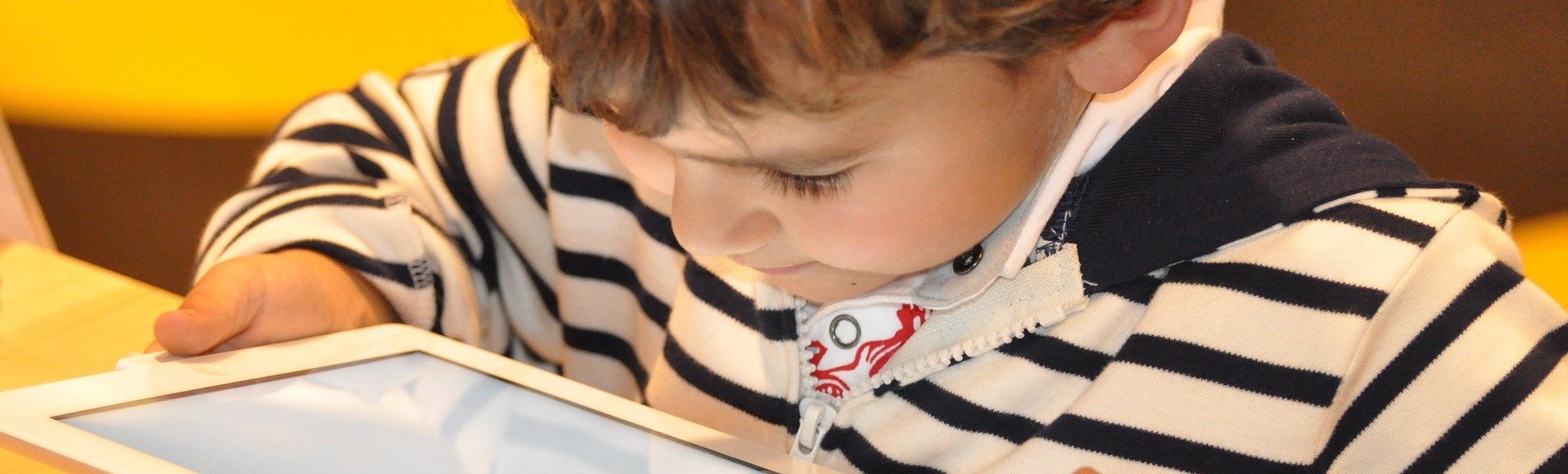 boy looking at a tablet